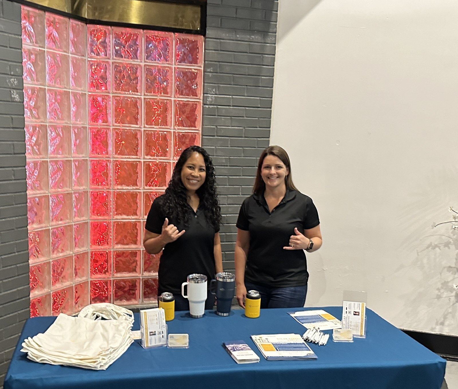 Anela Havellana and Laura Poirier at a community solar event